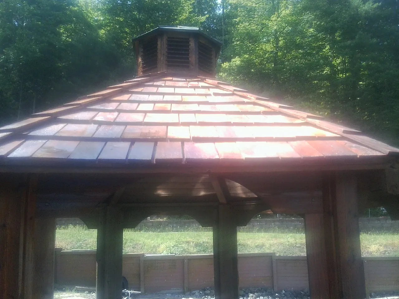 New cedar shake roof and cupola on a lakeside gazebo in Grahamsville